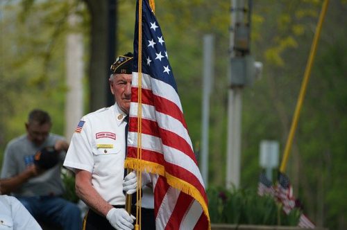 Veteran holding flag