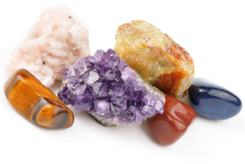 a selection of colorful rocks and minerals on a white background
