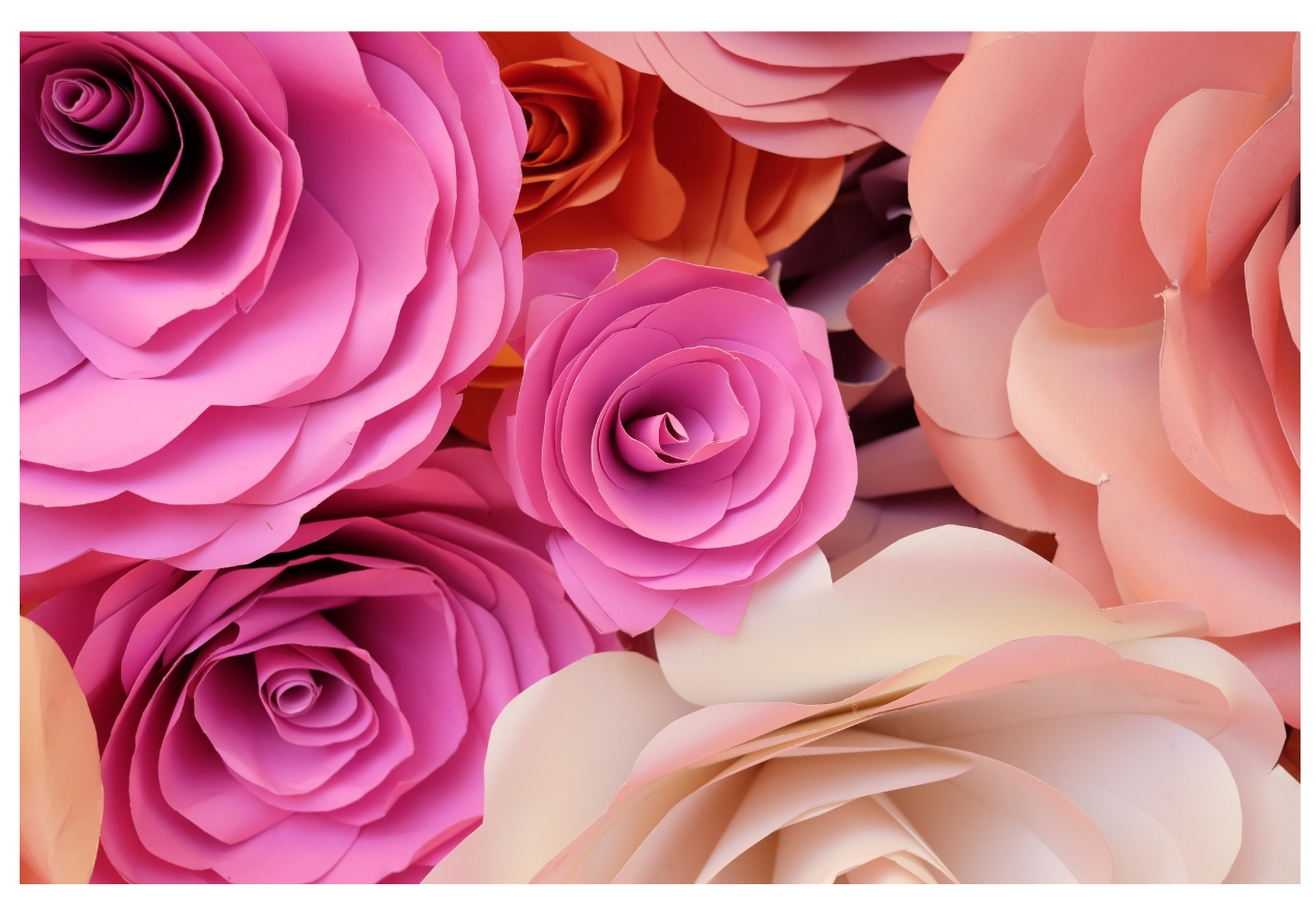 A photograph of a variety of roses made out of paper