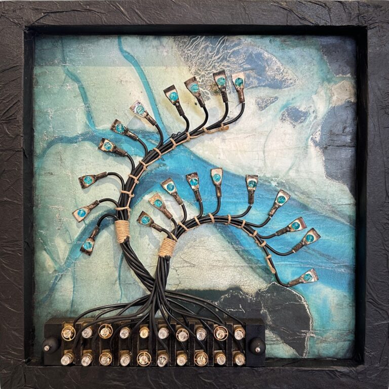 A photograph of a three-dimensional picture which includes an old set of wires and electrodes from a primitive computer fashioned to look like branches of a tree